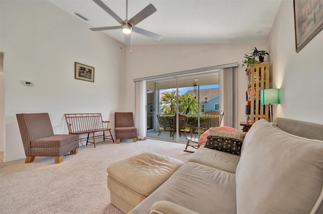 carpeted living room with lofted ceiling and ceiling fan