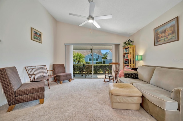 living room with ceiling fan, light colored carpet, and lofted ceiling