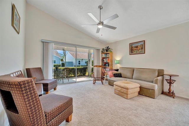 carpeted living room featuring high vaulted ceiling and ceiling fan