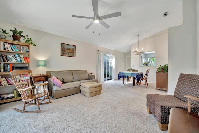 living room featuring vaulted ceiling, carpet flooring, and ceiling fan with notable chandelier