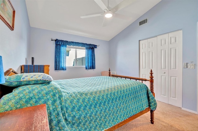 bedroom with lofted ceiling, carpet floors, a closet, and ceiling fan