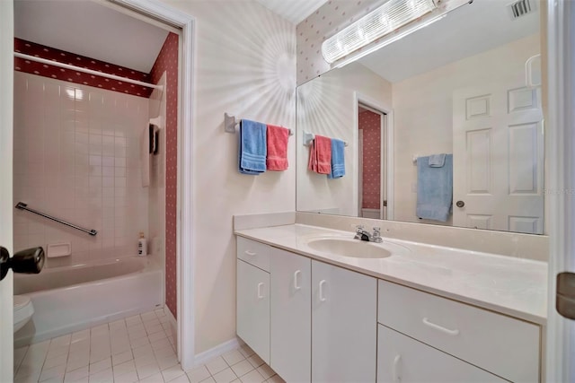 full bathroom with vanity, toilet, tile patterned floors, and shower / bathing tub combination