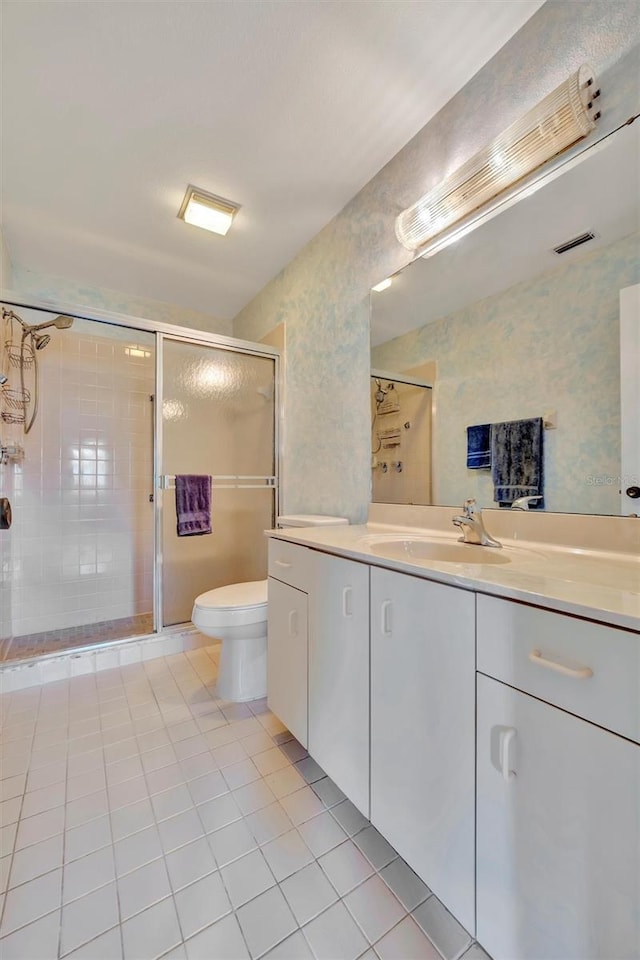 bathroom with vanity, an enclosed shower, tile patterned floors, and toilet