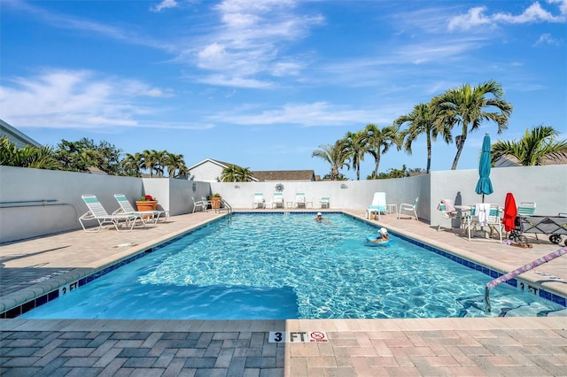 view of swimming pool featuring a patio area