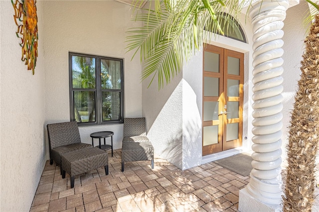 view of exterior entry featuring french doors