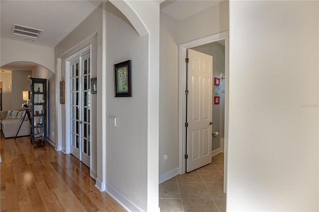 hall with light wood-type flooring