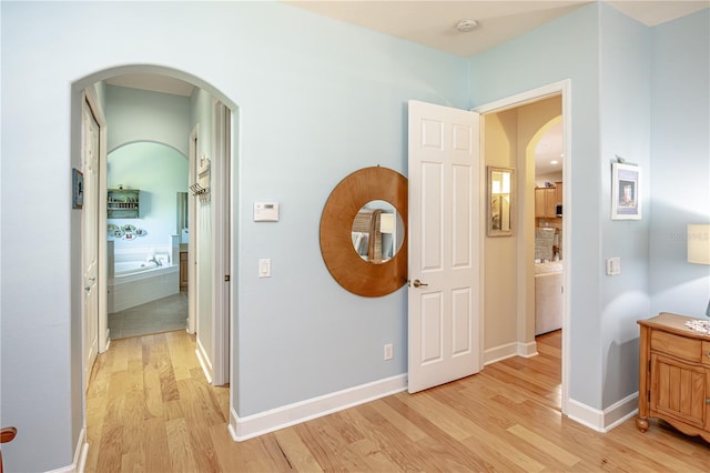 hall with light wood-type flooring