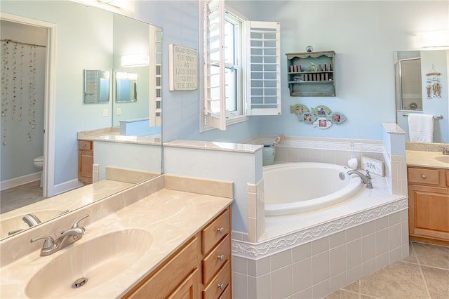 full bathroom with vanity, tile patterned flooring, independent shower and bath, and toilet