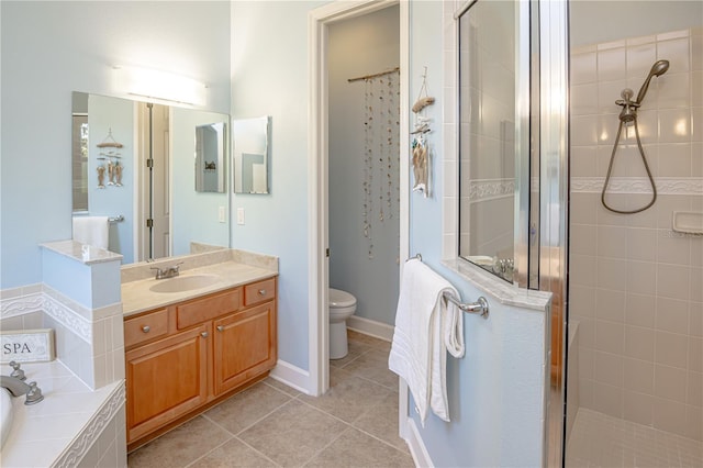 full bathroom with tile patterned flooring, vanity, independent shower and bath, and toilet