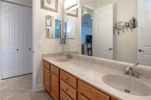 bathroom with tile patterned flooring and vanity