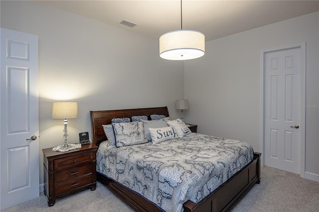 bedroom featuring light carpet