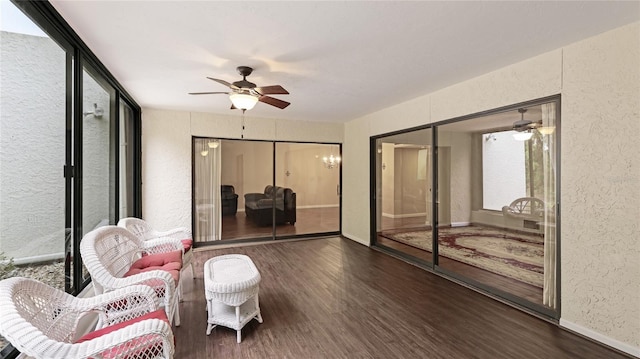 sunroom with ceiling fan