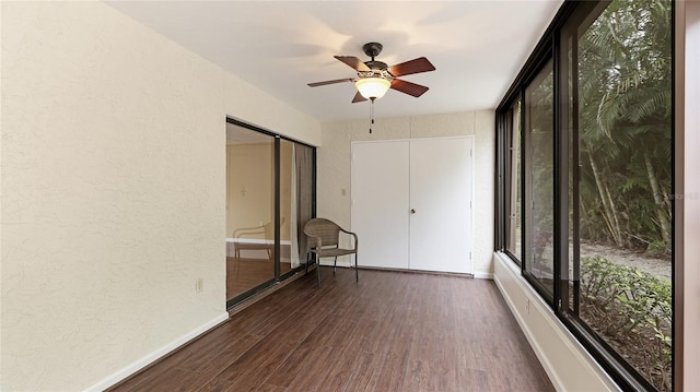 unfurnished room featuring dark hardwood / wood-style flooring and ceiling fan