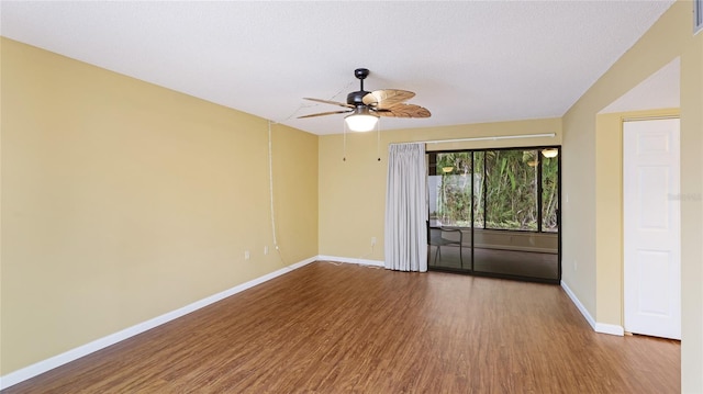 spare room featuring ceiling fan, hardwood / wood-style floors, and a textured ceiling