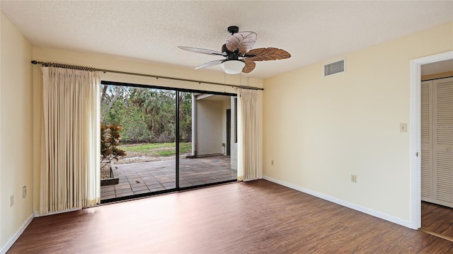 unfurnished room featuring wood-type flooring, ceiling fan, and a textured ceiling