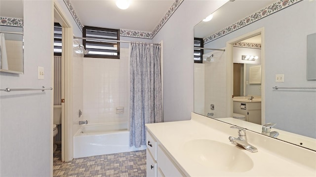 full bathroom featuring shower / bath combination with curtain, vanity, and toilet