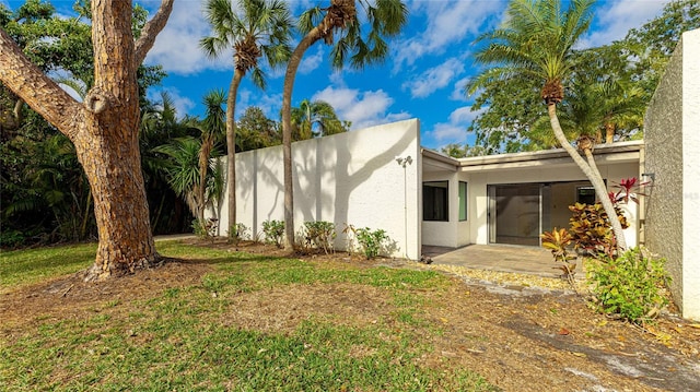 view of home's exterior with a patio area