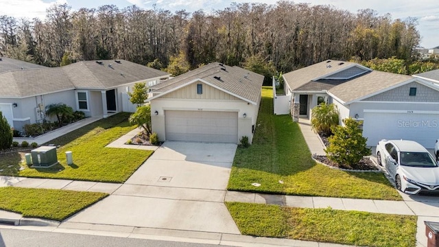 single story home with a garage and a front yard