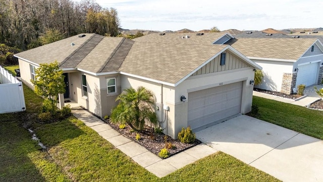 view of front of house with a garage and a front lawn