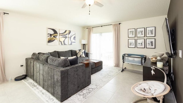 living room featuring light tile patterned floors and ceiling fan