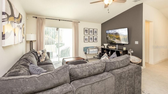 living room with ceiling fan, baseboards, and vaulted ceiling