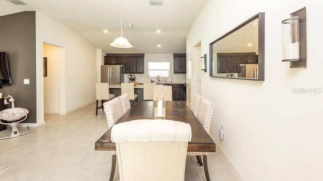 dining area featuring recessed lighting, visible vents, vaulted ceiling, and light tile patterned floors