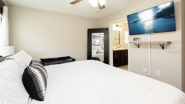 bedroom featuring ensuite bathroom and a ceiling fan