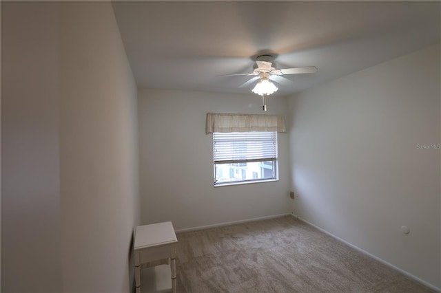 empty room with carpet and ceiling fan