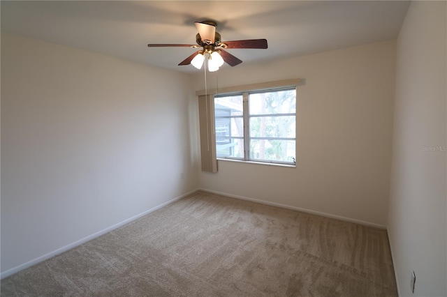 carpeted empty room with ceiling fan