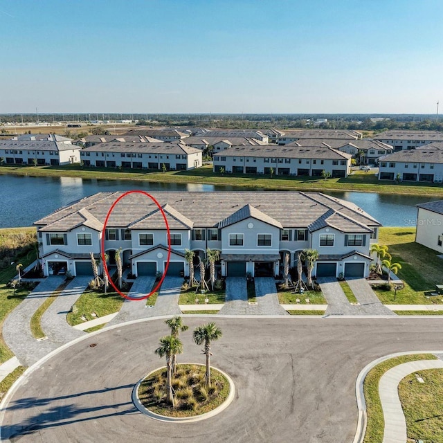 drone / aerial view with a water view