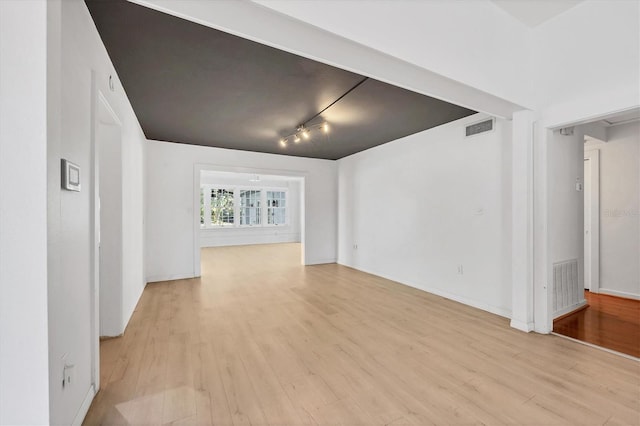 unfurnished living room featuring light wood-type flooring