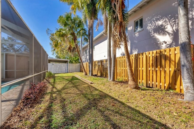 view of yard featuring a lanai