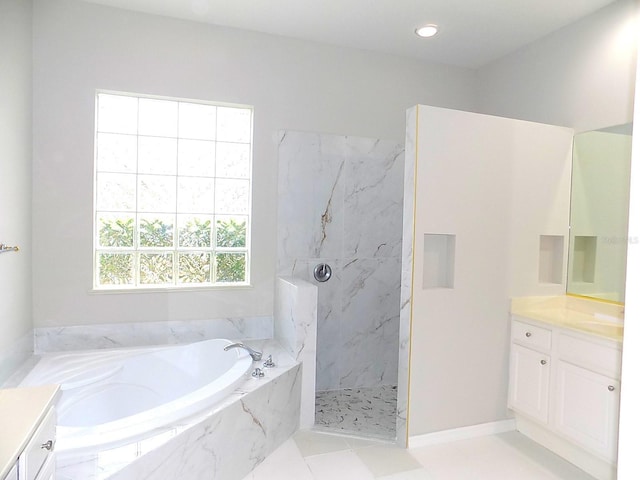 bathroom with independent shower and bath and vanity