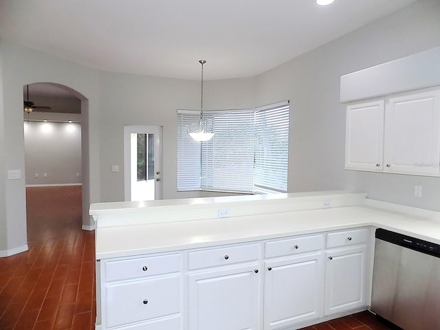 kitchen with decorative light fixtures, dishwasher, kitchen peninsula, and white cabinets