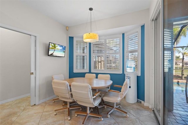 dining area featuring a wealth of natural light and baseboards