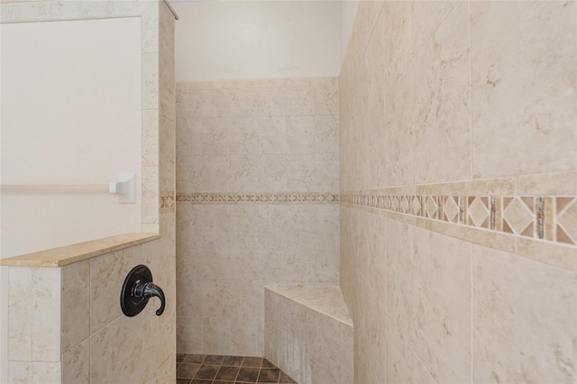 full bathroom featuring tiled shower