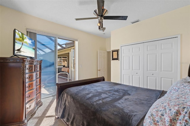 carpeted bedroom featuring ceiling fan, access to outside, a closet, and visible vents