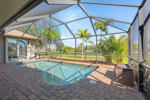 pool with a patio and a lanai