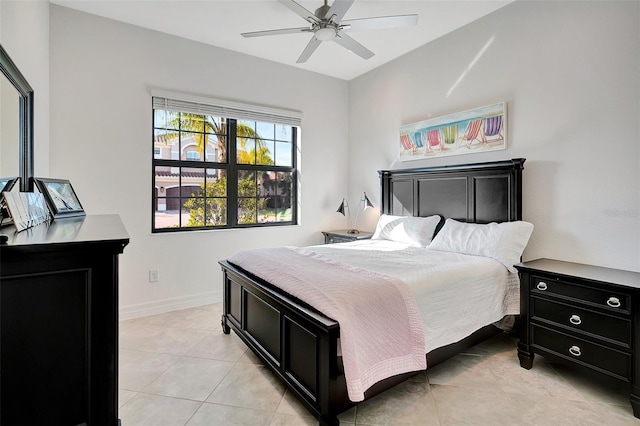 tiled bedroom with ceiling fan