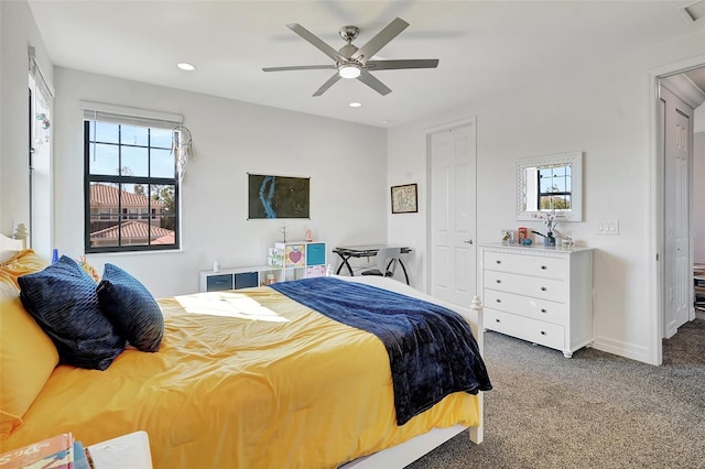 carpeted bedroom featuring a closet and ceiling fan