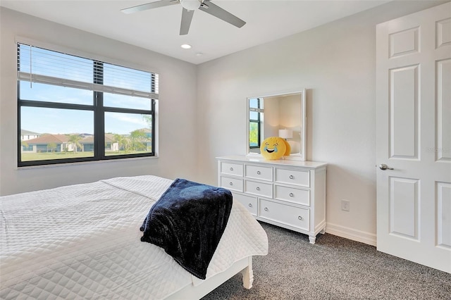 bedroom with ceiling fan and carpet