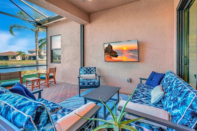 view of patio / terrace with an outdoor living space and a water view