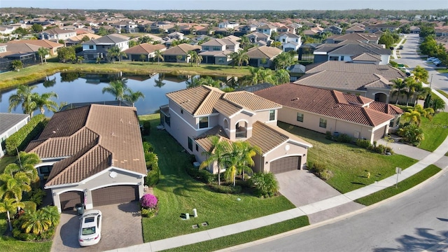 drone / aerial view with a water view