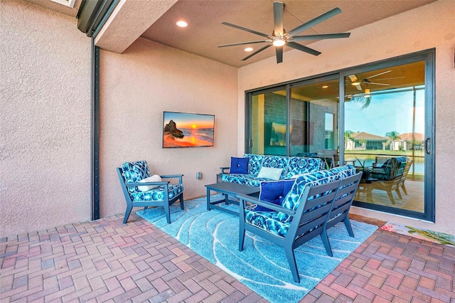 view of patio featuring an outdoor hangout area and ceiling fan