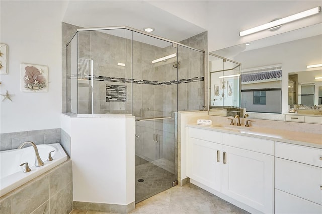 bathroom featuring vanity and separate shower and tub