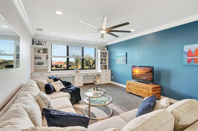 living room with ornamental molding, light carpet, ceiling fan, and built in desk