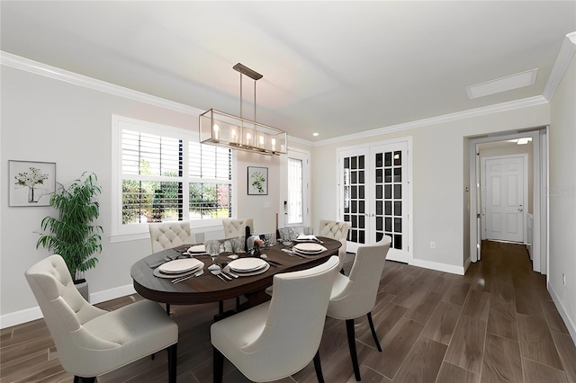 dining area with crown molding, dark hardwood / wood-style flooring, and french doors