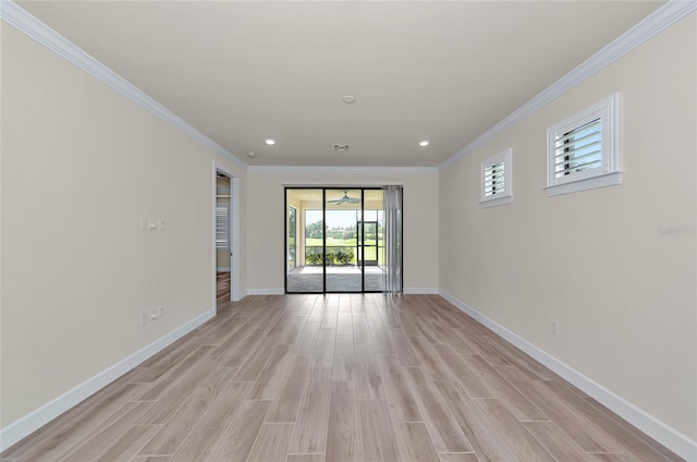 spare room with recessed lighting, baseboards, light wood finished floors, and ornamental molding