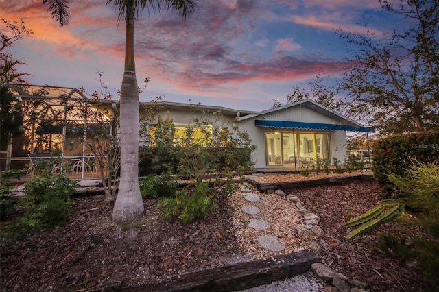 view of property exterior at dusk