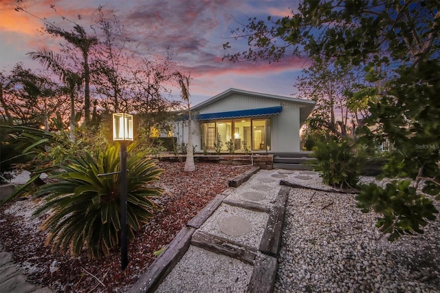 view of property exterior at dusk